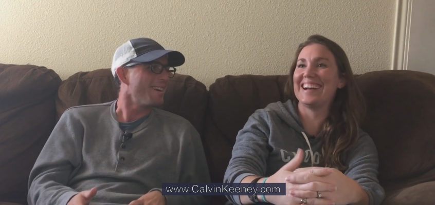 Calvin Keeney and Casey Dickerson talking and laughing on the couch