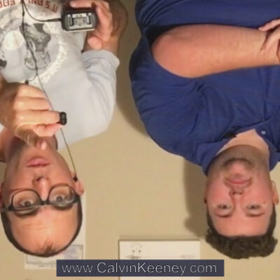 Calvin Keeney and Blaze Kunkel upside down looking at the camera. Calvin is pointing at the camera and Blaze has his arms crossed