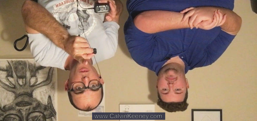 Calvin Keeney and Blaze Kunkel upside down looking at the camera. Calvin is pointing at the camera and Blaze has his arms crossed