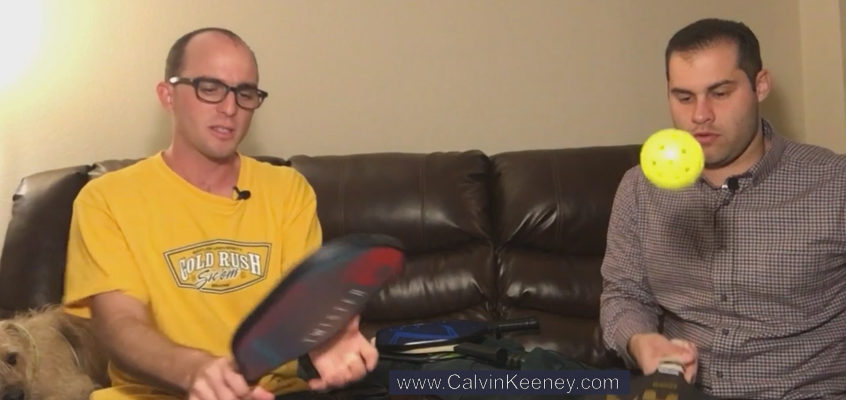 Calvin Keeney and Justen Aguillon holding Pickleball Paddles as Calvin Introduces Justen to PIckleball. Justen is hitting a Pickleball in the air with his paddle