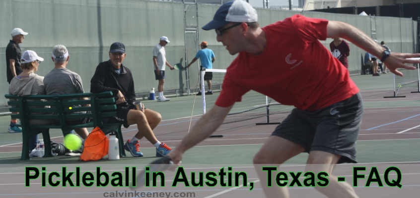 Calvin Keeney in a red Zero Zero Start tshirt hitting a bright yellow pickleball